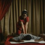 A calming massage therapy session in a spa setting with a focus on relaxation and wellness.